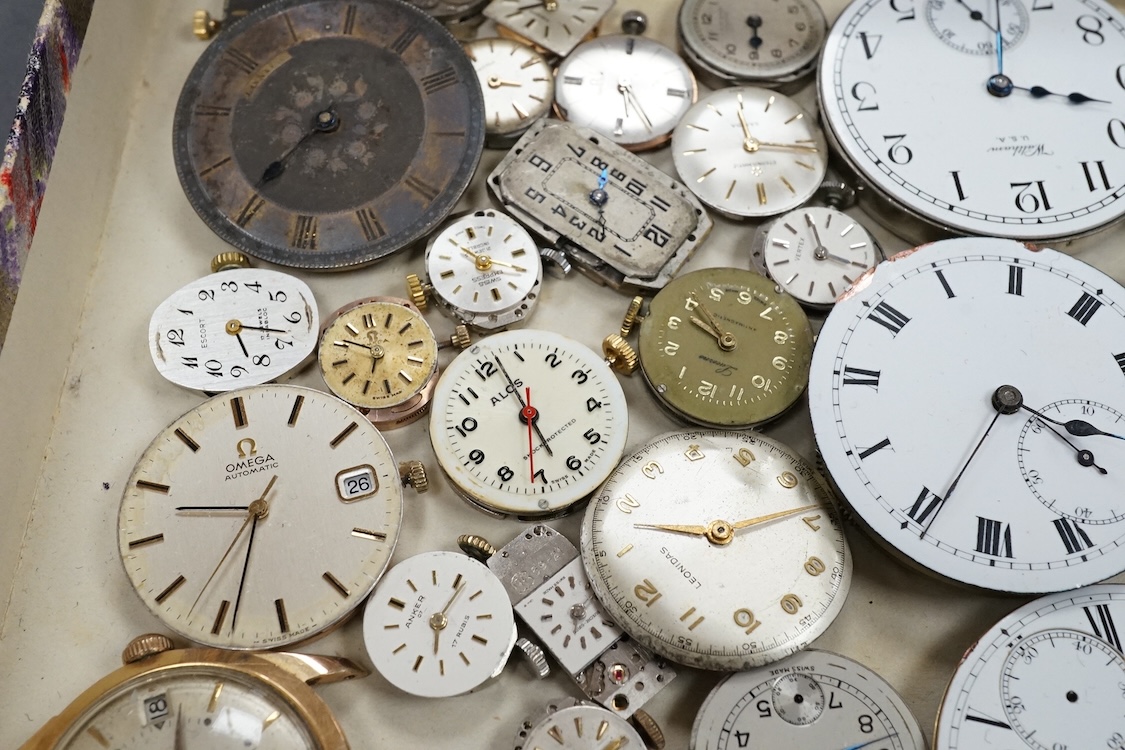 A quantity of assorted wrist and pocket watch movements, including Omega and Omega automatic, together with a pocket watch and a 935 white metal fob watch.